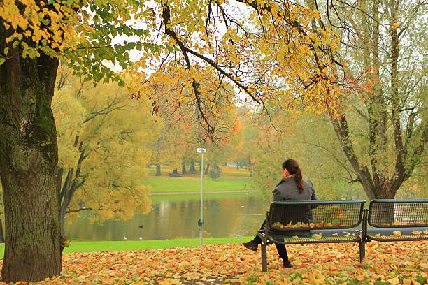 istock Lady Sitting Alone in the Park 503191858