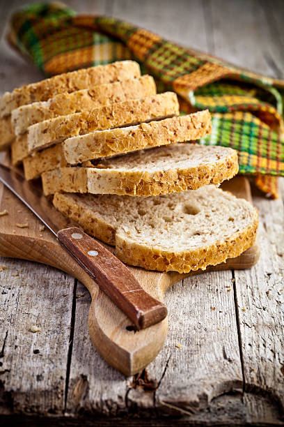 istock bread slices on wooden board 503191913