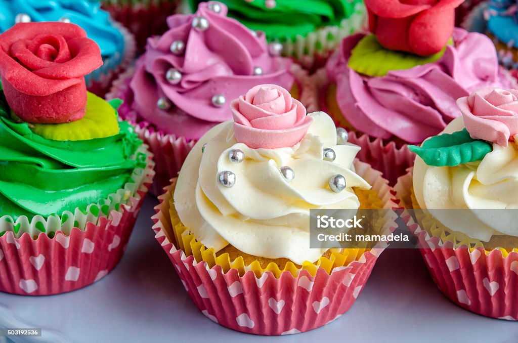 Cupcakes decorated Cupcakes decorated with butter cream in various colors Baked Stock Photo