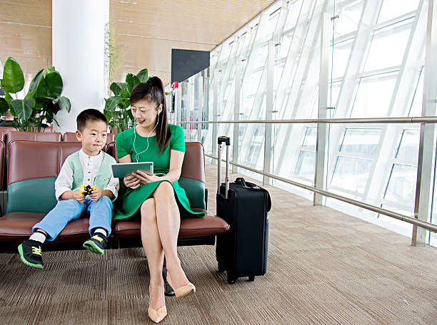 istock Mother and son at airport 503193214