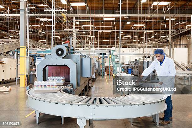 Bottling Plant And Machinery Stock Photo - Download Image Now - Conveyor Belt, Manufacturing Occupation, Bottling Plant