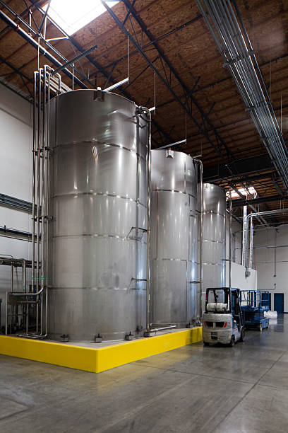 Huge silos and a forklift at bottling plant