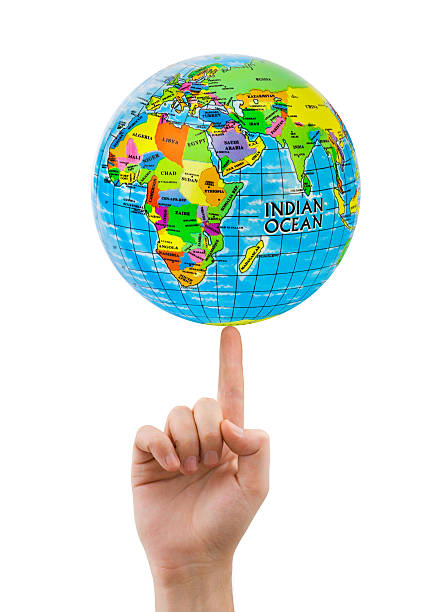 Hand and spinning globe Hand and spinning globe isolated on white background finger spinning globe stock pictures, royalty-free photos & images