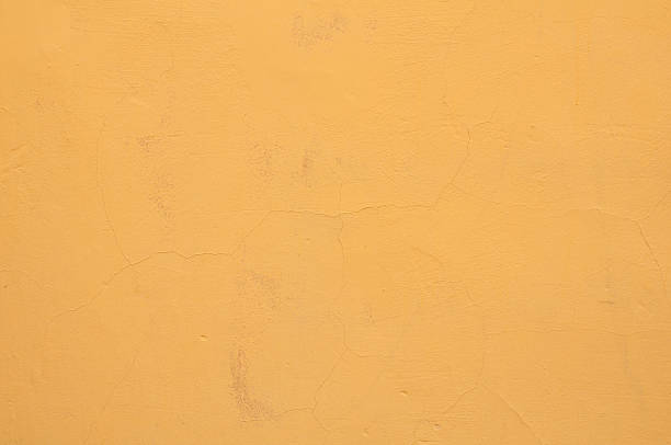 istock Texture of old wall with yellow stucco 503193909