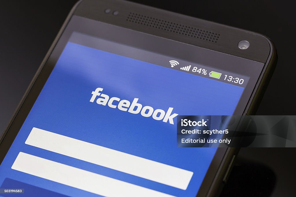 Facebook application on smart phone screen. BELCHATOW, POLAND - APRIL 06, 2014: Facebook application on smart phone screen. Admiration Stock Photo