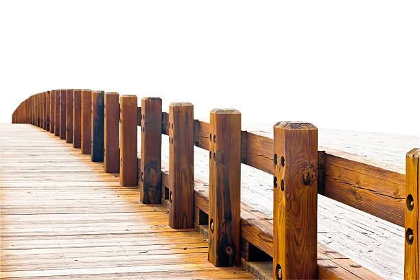 Curved wooden bridge with two paths, isolated on white.