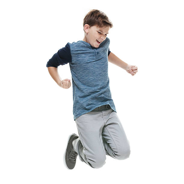 istock Smiling little boy jumping and cheering 503195580