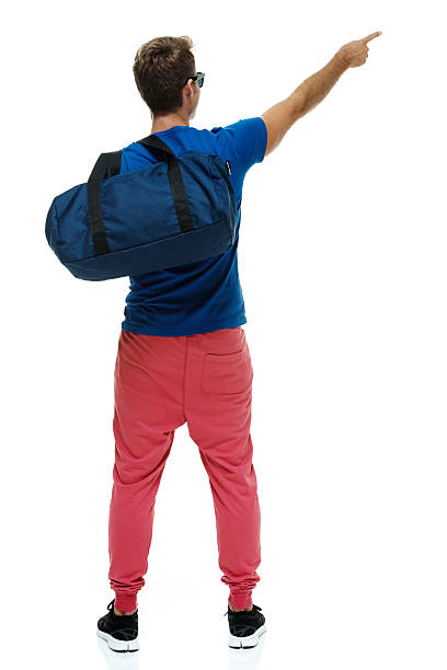 istock Rear view of casual man pointing away 503196492