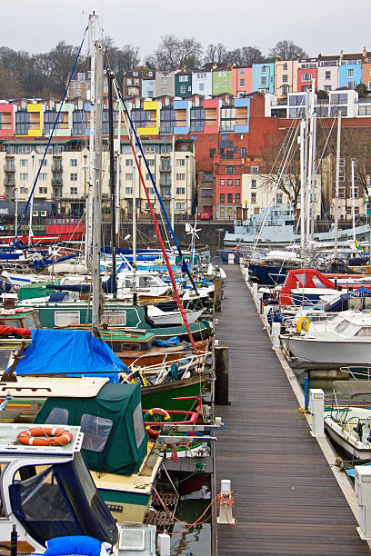Winter moorings in Bristol harbour, overlooked by colourful housing terraces