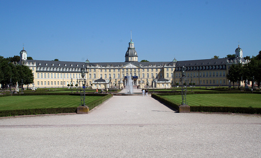 Karlsruhe, Germany - August 1, 2007: Karlsruhe Palace (Schloss Karlsruhe) as viewed from the Schlossplatz. The building was erected in 1715 by Margrave Charles III William of Baden-Durlach, and the city has grown around it.