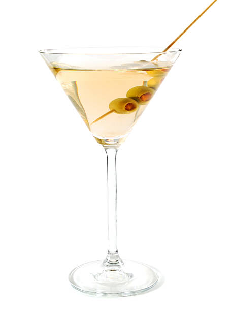 The classical, dry martini The classical, dry martini should be made with dry vermouth and be garnished with green olives. vermouth stock pictures, royalty-free photos & images