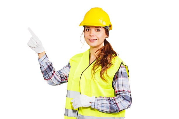 istock Young woman in construction helmet and yellow vest 503198732