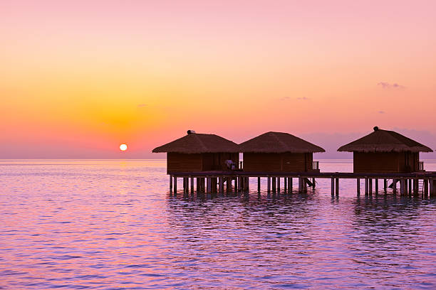 Water bungalows on Maldives island - nature travel background
