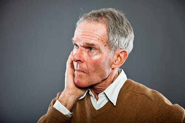 istock Funny and characteristic senior man against grey wall. 503205877