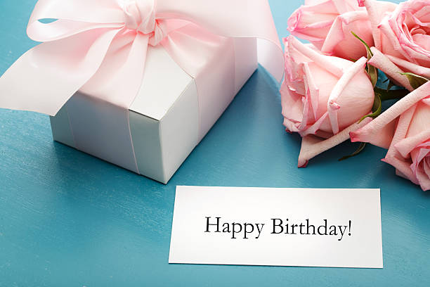 istock Birthday message card with gift box and roses 503207971