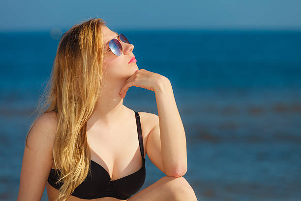 istock Summer vacation Girl in bikini sunbathing on beach 503208883
