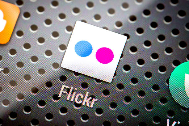 BELCHATOW, POLAND - APRIL 10, 2014: Closeup photo of Flickr icon on mobile phone screen. Popular social network.