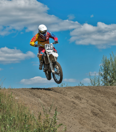 Ramenskoye, Russia - July 20, 2014: Riders pass route in action during motorcross motor club Forsazh event in Ramenskoye district, Moscow region.