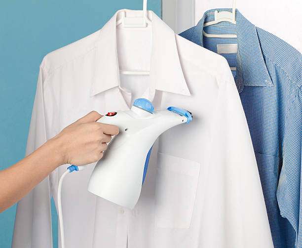 istock Housewife using steam iron 503210429