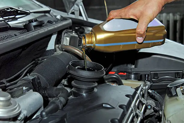 Photo of Adding Oil to a Car