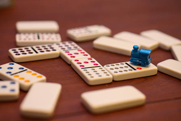 istock mexican train dominoes on coffee table 503218860