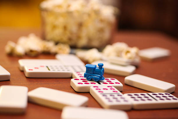 mexican train dominoes on coffee table stock photo