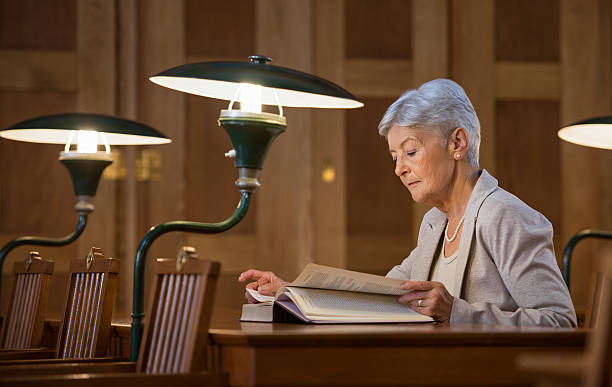 istock Senior Female Professor In Library 503219324