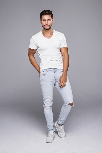 Handsome man wearing jeans and white t-shirt