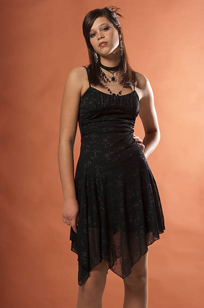 Sassy Teen Girl In A Black Party Dress Stock Photo - Download Image Now -  14-15 Years, Arts Culture and Entertainment, Attitude - iStock