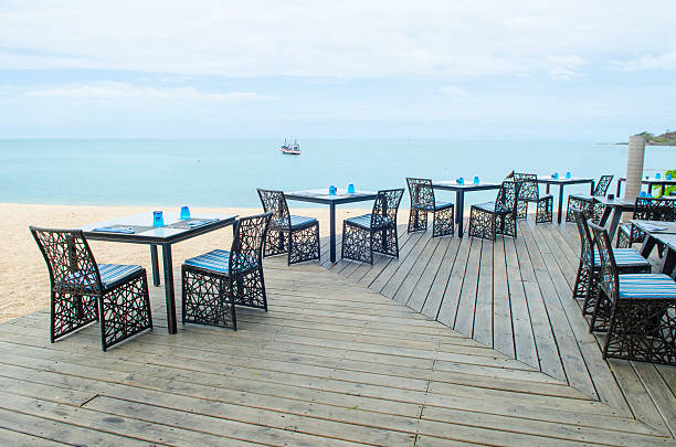 istock Table and chair setting on the beach with blue sky 503220945