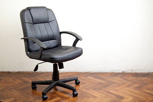 istock Black leather office chair in room 503222320