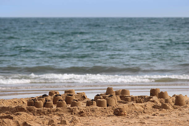 istock Image of sandcastles on beach, sand-castles made on seaside holiday 503222889