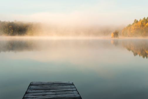 Colorful sunrise on Bobiecino lake in north Poland. Pomerania province.