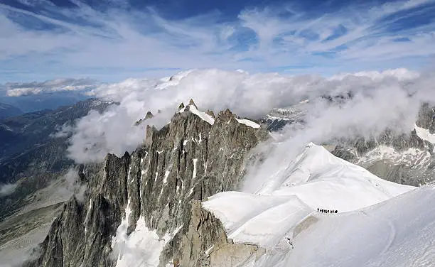 France, mountain landscape, groups of tourists climbing Mont Blanc