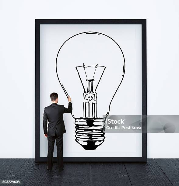 Businessman Drawing Lamp Stock Photo - Download Image Now - Adult, Brainstorming, Business