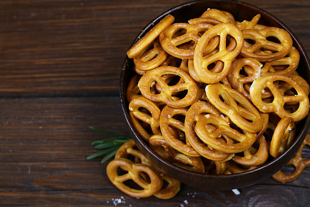 istock Salty snacks mini pretzels with salt and spices 503224790