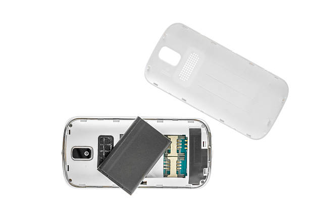 Disassembled old mobile phone isolated on white background.