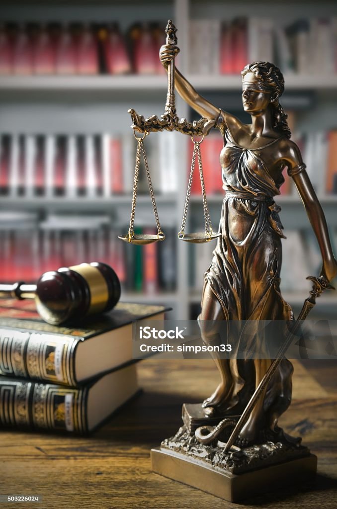 Themis and gavel in court library Themis and gavel in court library. Law conception Lady Justice Stock Photo