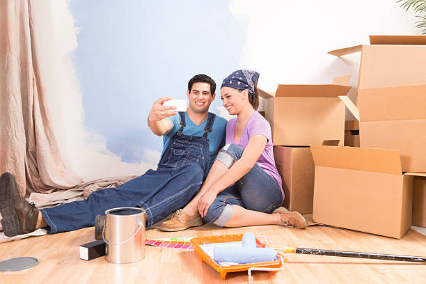 istock Construction: Latin couple. Home improvement, moving. Taking 'selfie.' 503227170