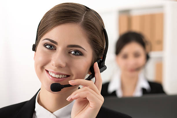 istock Portrait of call center worker accompanied by her team 503228528