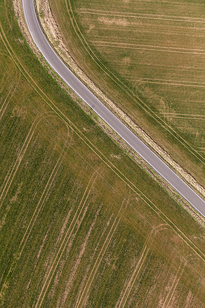 istock aerial view of spring time village harvest fields landscape 503229210