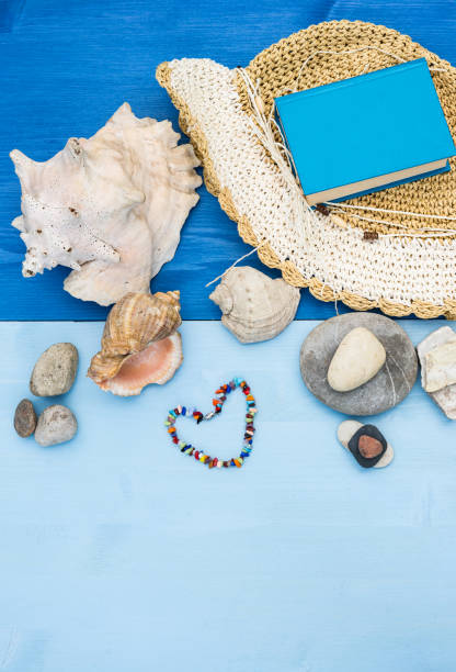 istock Summer sea vacation. Beach accessories. Sea shells, pebbles, panama hat. 503230100