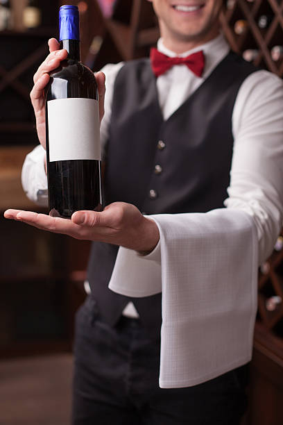 istock Cheerful young sommelier is showing perfect beverage 503239184