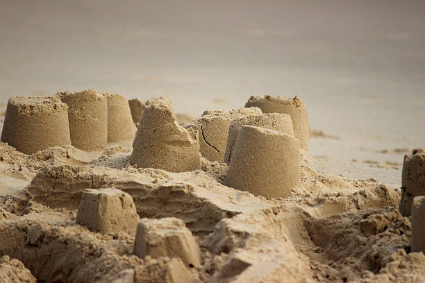 istock Image of sandcastles on beach, sand-castles made on seaside holiday 503239607