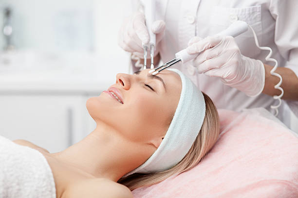 istock Cheerful female therapist is curing human skin 503239924
