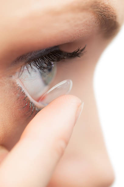 istock Extreme close up on pretty model applying contact lens 503240329