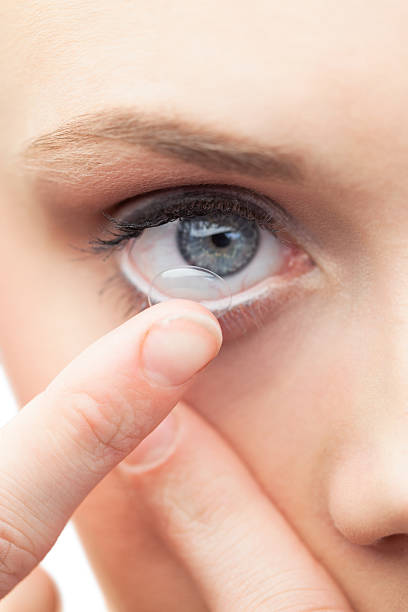 istock Beautiful model applying contact lens 503240415