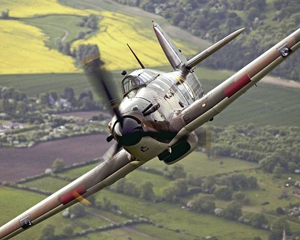 RAF Battle of Britain Memorial Flight Hurricane, aerial photograph Battle of Britain Memorial Flight Spifire and Hurricane from RAF Coningsby, perform a 'split' during a flypast display. raf stock pictures, royalty-free photos & images