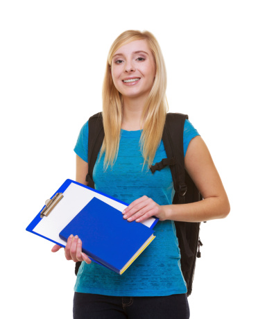 Portrait of casual blond smiling girl in blue jeans female student with bag backpack and notebook book folder isolated on white. Education and college. Studio shot