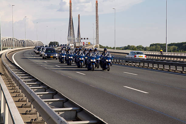 Zaltbommel, The Netherlands - 24 JULY 2014. A procession of hearses crosses the Martinus Nijhoff bridge on the A2 highway, carrying victims of the crash of Malaysian Airlines flight 17 in Ukraine. MH17 was downed on July 17th 2014, all 298 people on board perished.